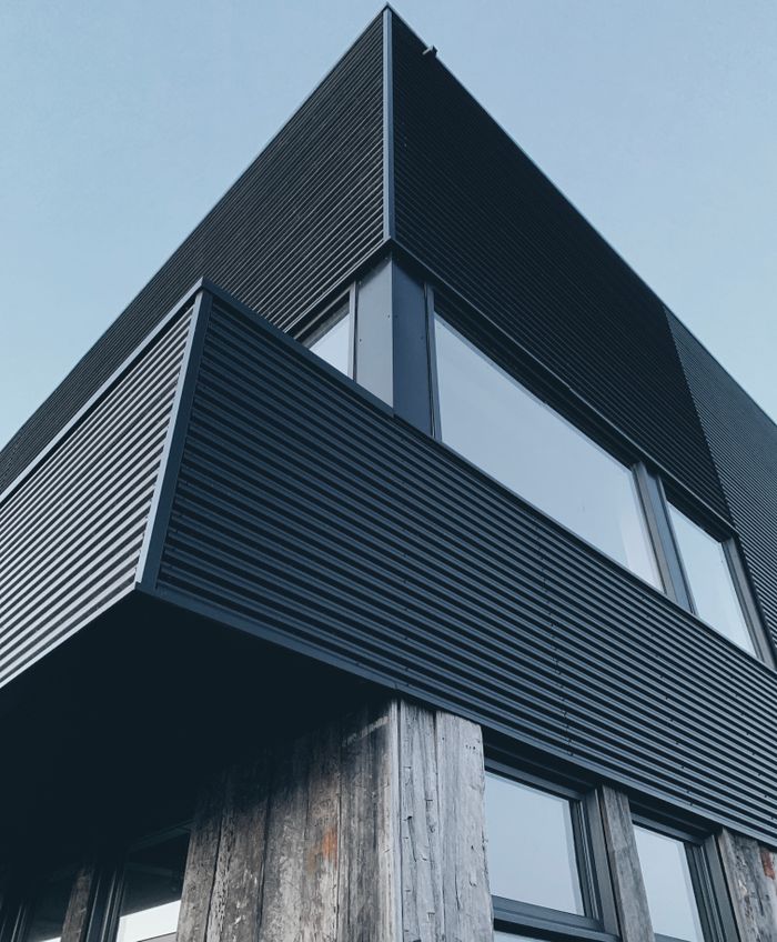 A striking low angle view of a modern building facade in Alkmaar, Netherlands.